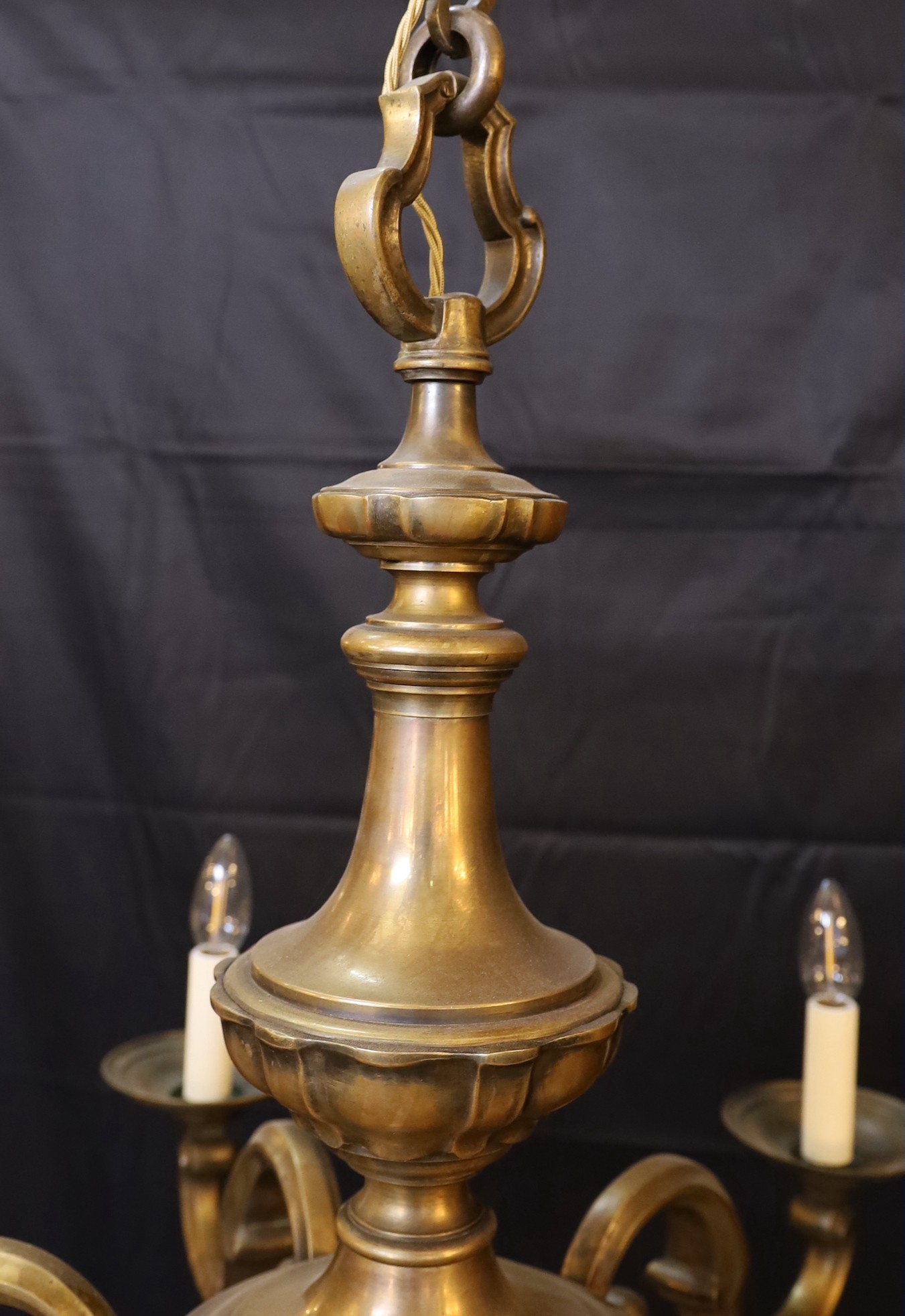A 1920s-30s French bronze six light chandelier, height including rose 80cm. width 82cm